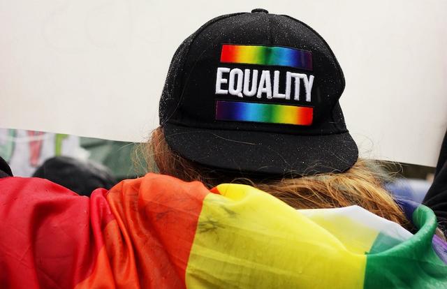 hat that says "equality" with a rainbow gradient
