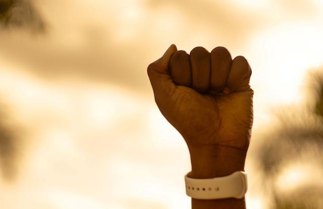 fist raised in protest