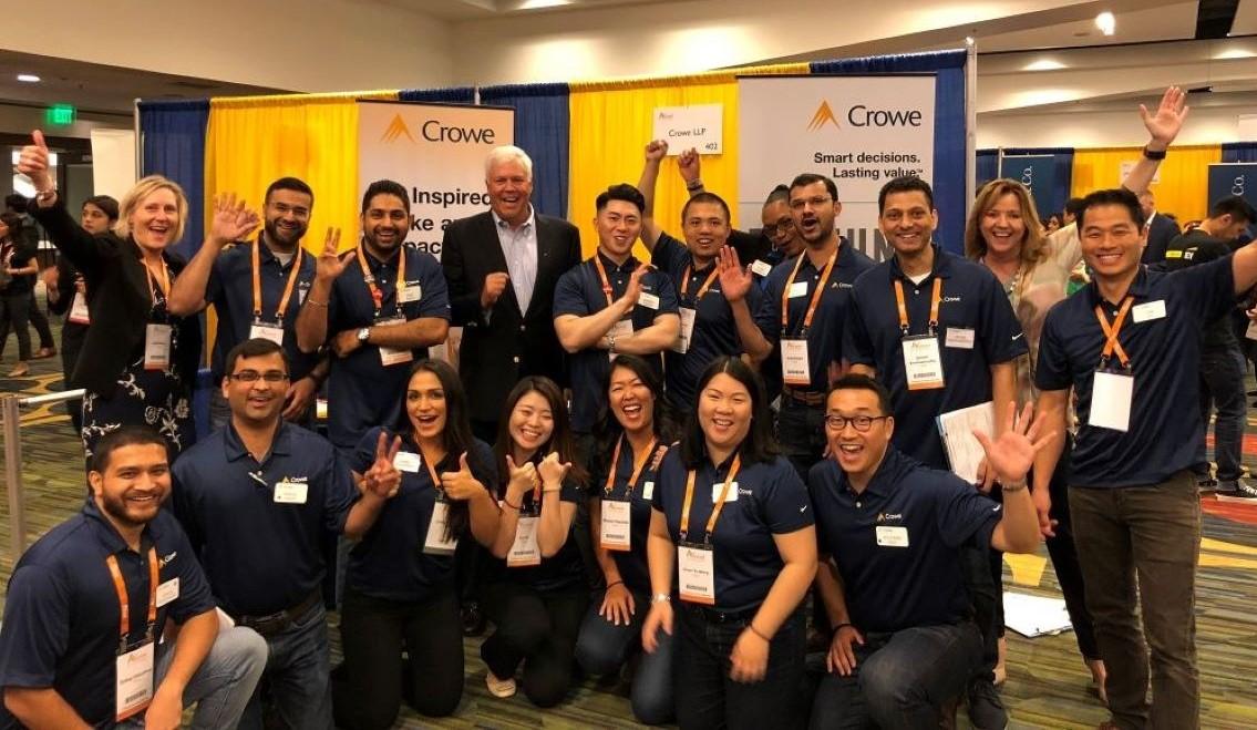 group of employees posing for a group shot at an event