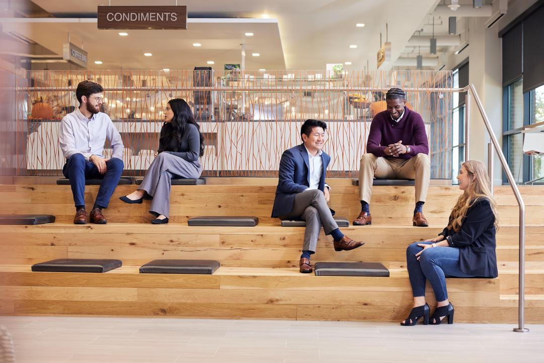 People speaking on benches