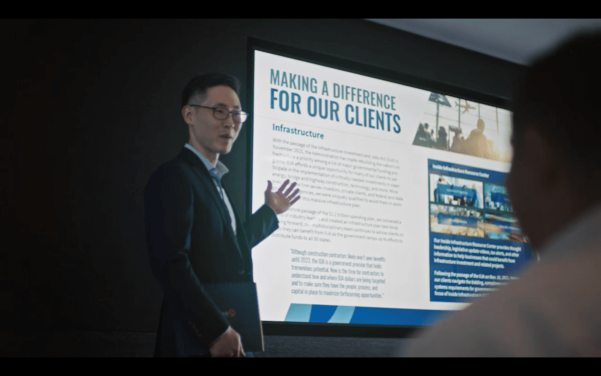 man presenting a power point to a meeting