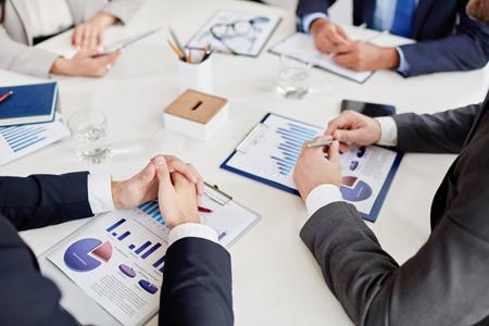 business meeting discussing charts